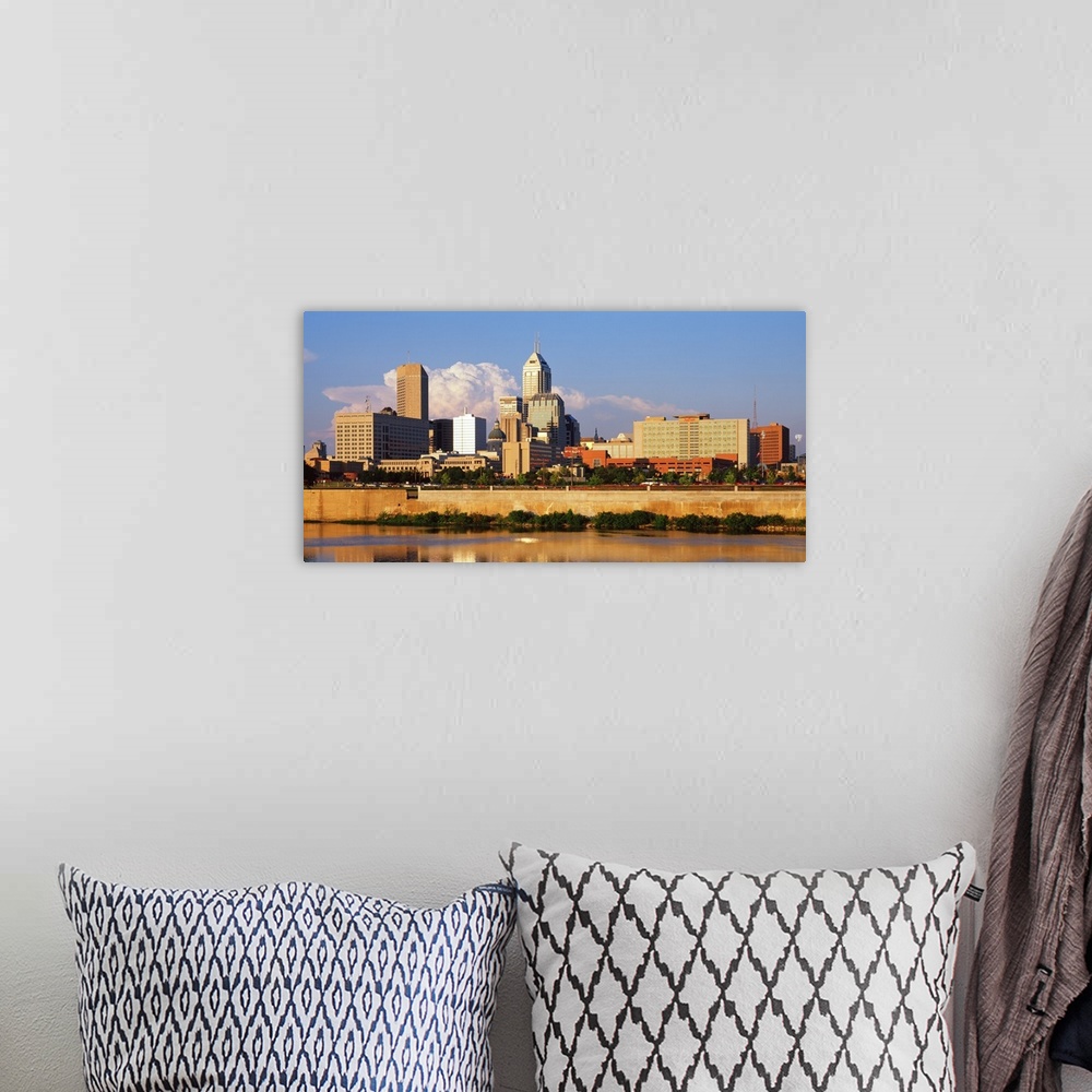 A bohemian room featuring Photograph of the Indianapolis, Indiana city skyline from the water on a sunny day.