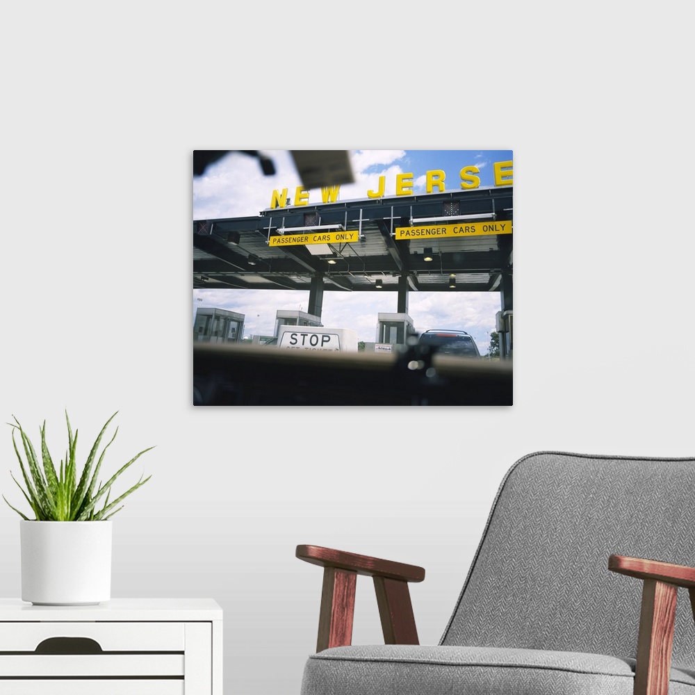 A modern room featuring Horizontal, large photograph taken through a car windshield of an information board at a New Jers...