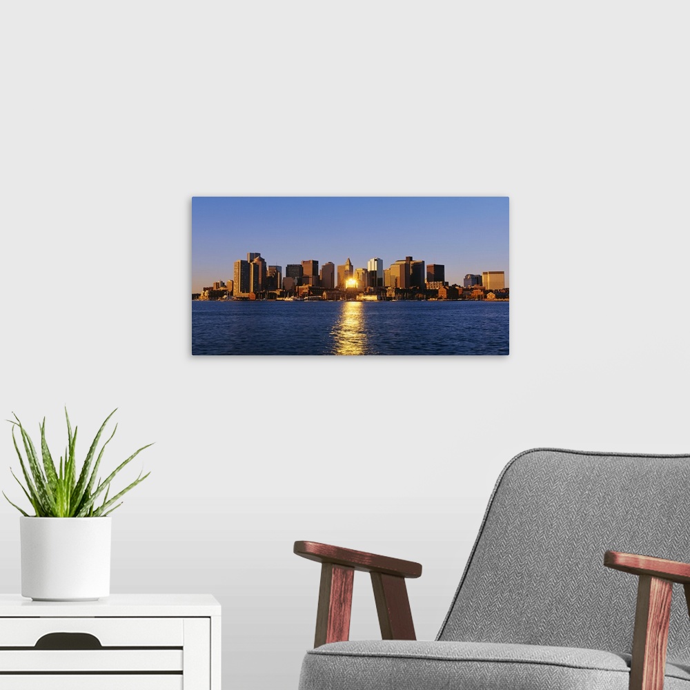 A modern room featuring Giant photograph displays the distant skyline of a busy city in the Northeastern United States.  ...