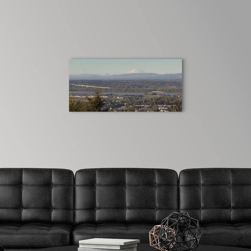 A modern room featuring Elevated view of Interstate 205 Bridge over Columbia River with Mount St. Helens and business pla...