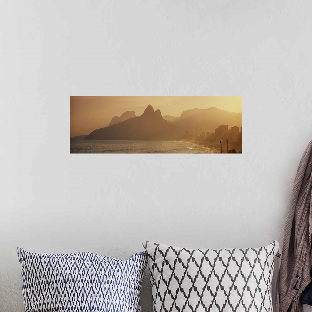 A bohemian room featuring Giant landscape photograph of silhouetted mountains near the coast of Ipanema Beach in Rio de Jan...