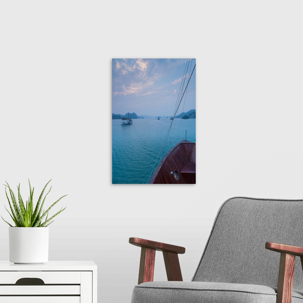A modern room featuring Islands and boat in the pacific ocean, ha long bay, quang ninh province, vietnam.