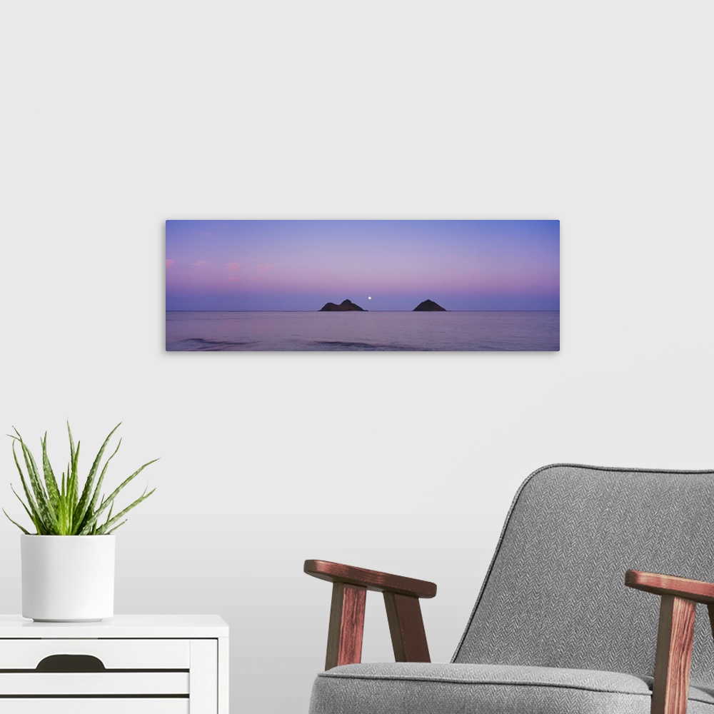 A modern room featuring Giant horizontal photograph of a pastel sky over the water near Oahu, Hawaii, the Na Mokulua Isla...