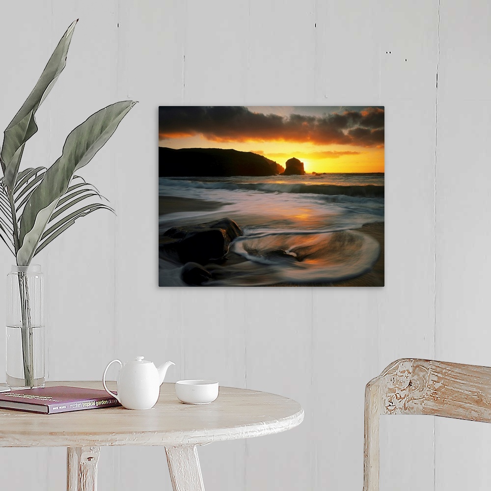 A farmhouse room featuring Beautiful time lapsed photography wall art of waves on the beach at sunset.