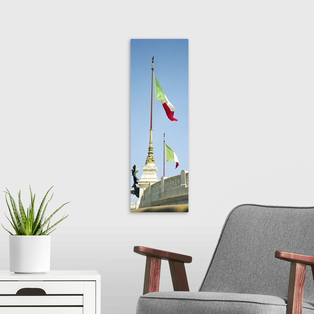 A modern room featuring Rome, Italy Italian flags on the Vittorio Emanuele II Monument