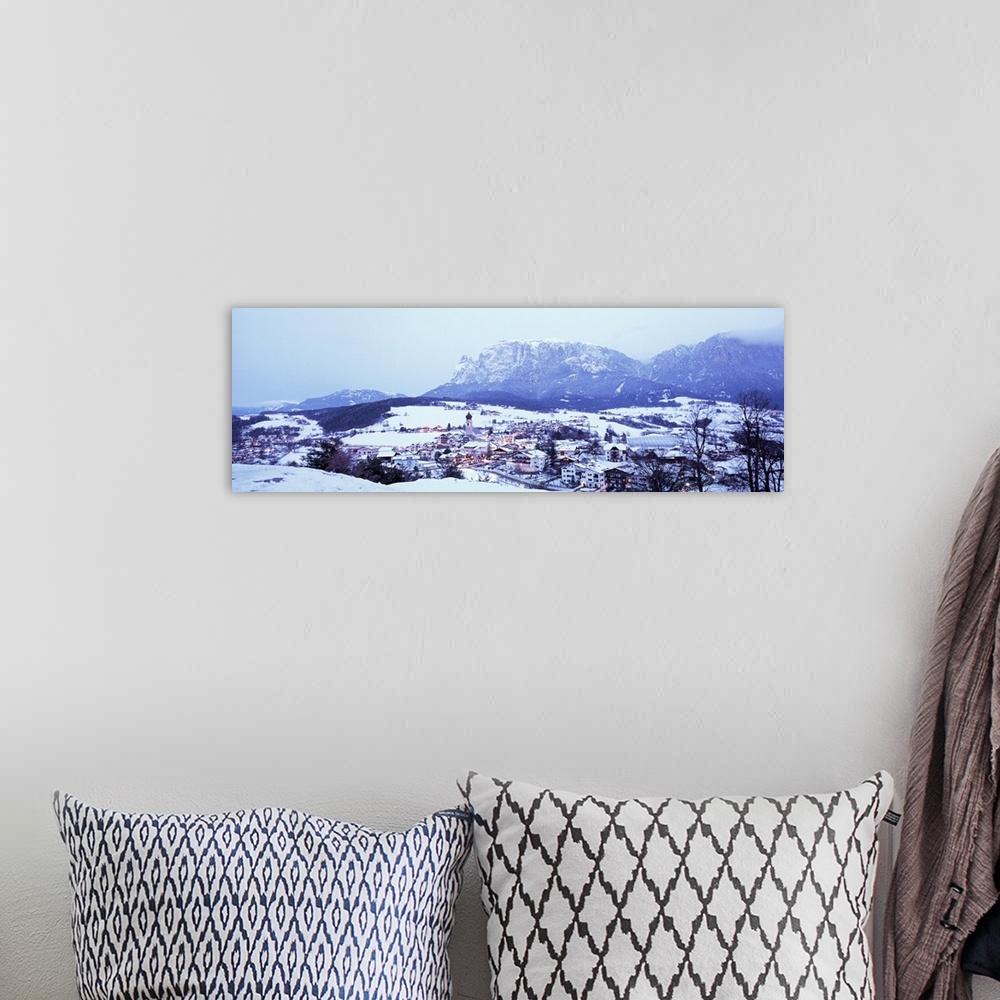 A bohemian room featuring Italy, Fie, Italian Alps, High angle view of town covered with snow