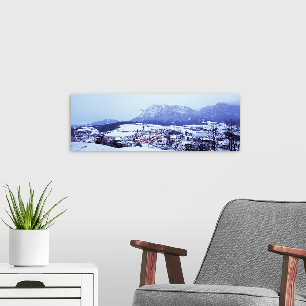 A modern room featuring Italy, Fie, Italian Alps, High angle view of town covered with snow