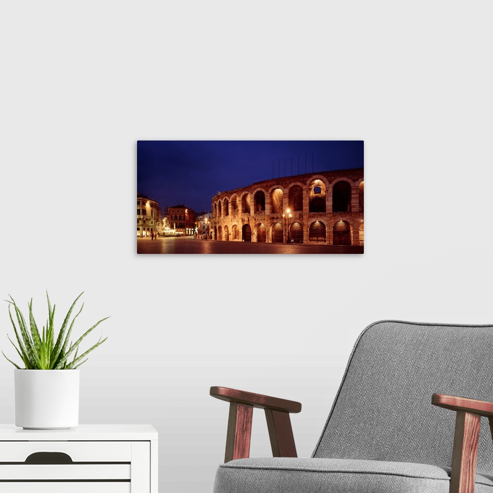A modern room featuring Italy, Verona, The Arena, evening