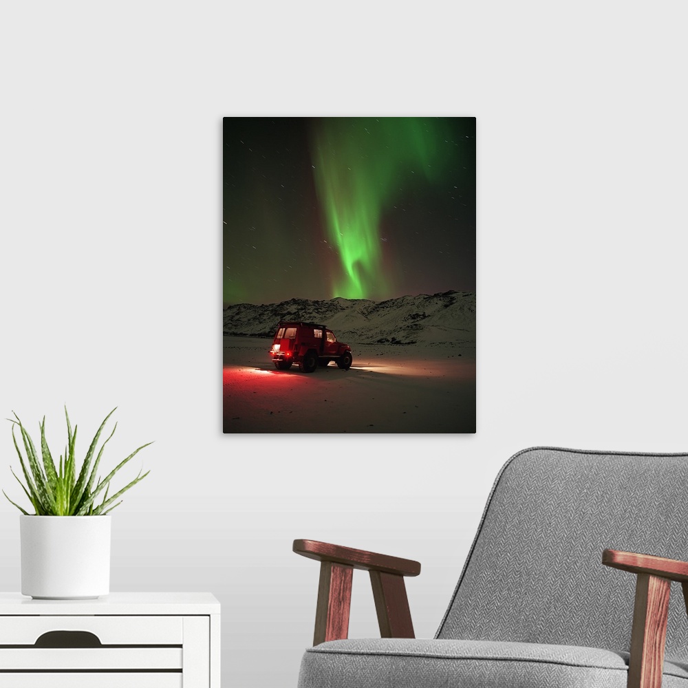 A modern room featuring Jeep in a snow covered field with Aurora Borealis in the sky