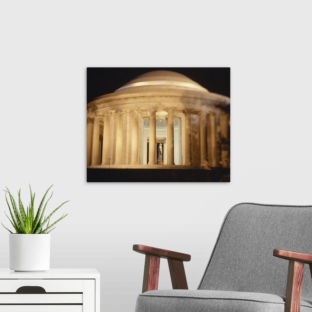 A modern room featuring Jefferson Memorial illuminated at night, Washington DC