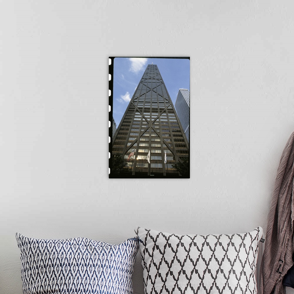 A bohemian room featuring Vertical photograph from below of the Hancock building during the day in Chicago, Illinois.