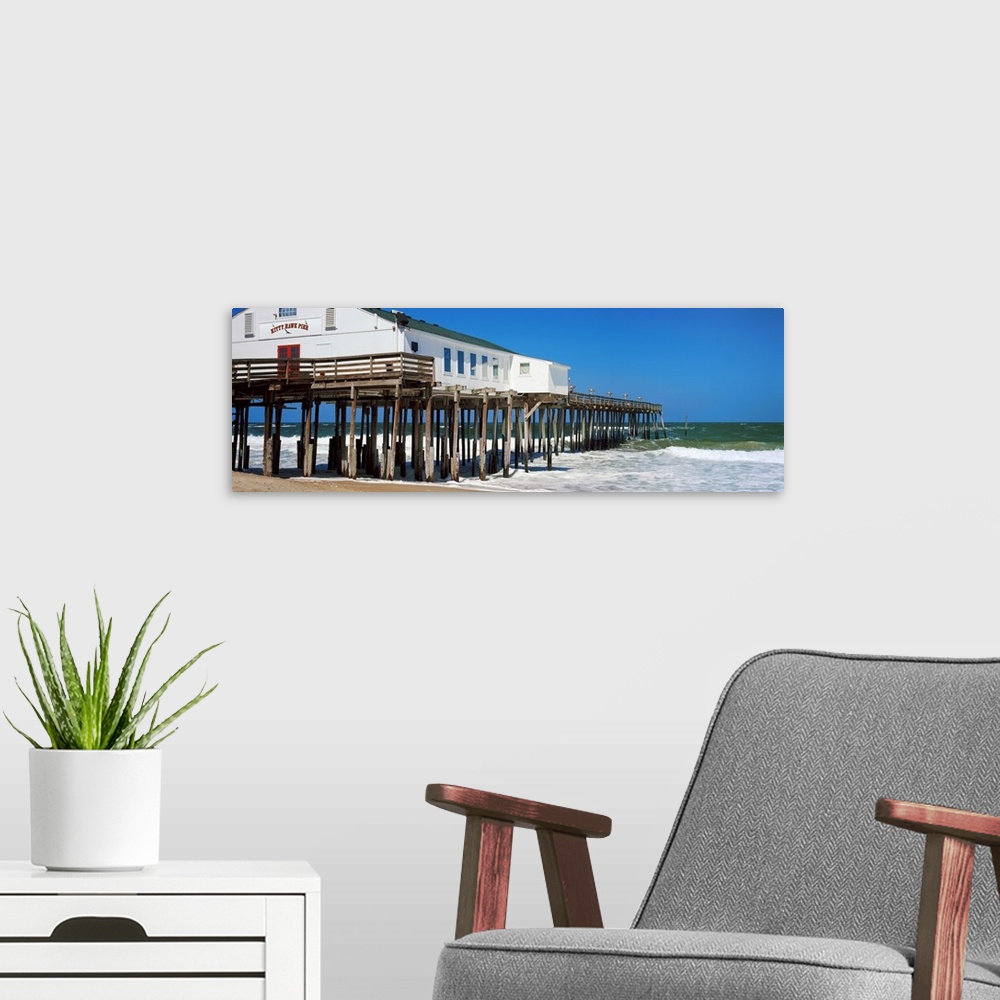 A modern room featuring Kitty Hawk Pier on the beach, Kitty Hawk, Dare County, Outer Banks, North Carolina, USA.