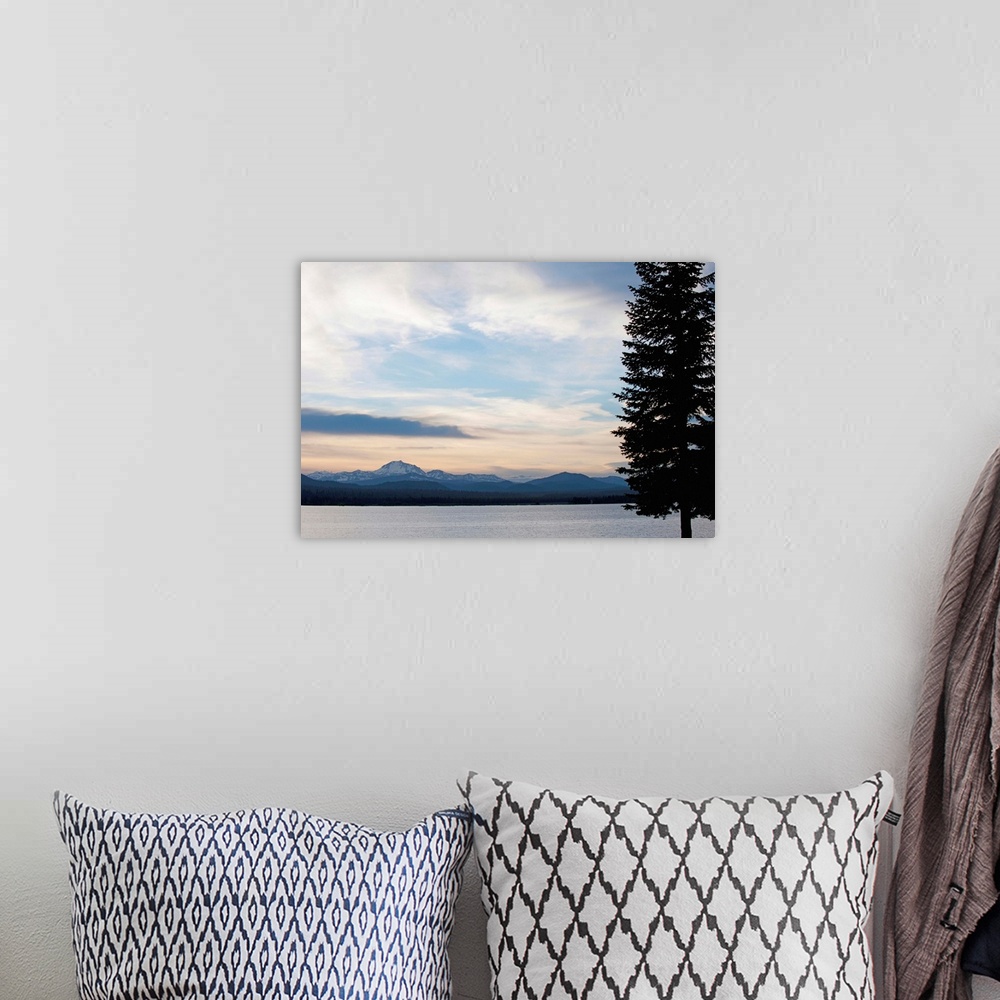 A bohemian room featuring Lake at sunset with mountains in the background, Mt Lassen, California