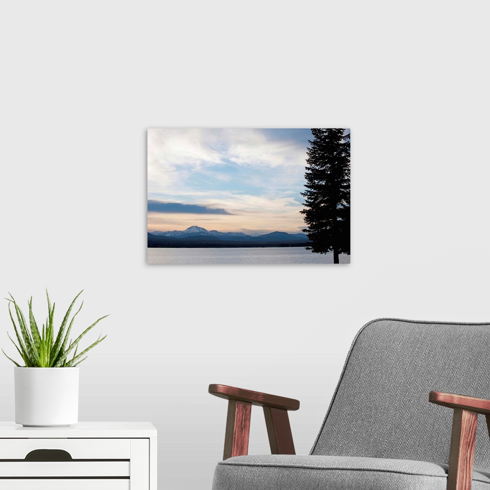 A modern room featuring Lake at sunset with mountains in the background, Mt Lassen, California