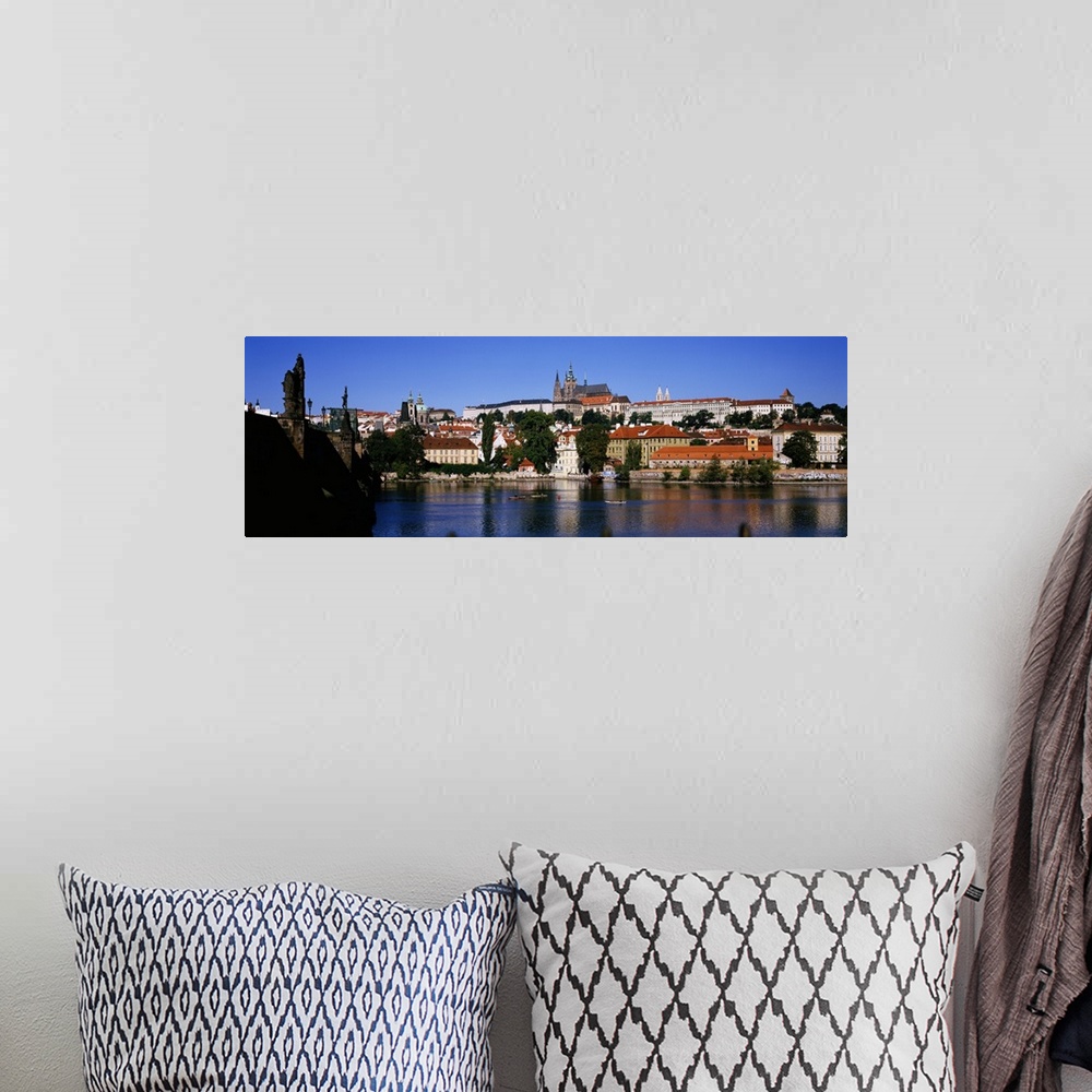 A bohemian room featuring Lake in front of a city, Charles Bridge, Prague, Czech Republic