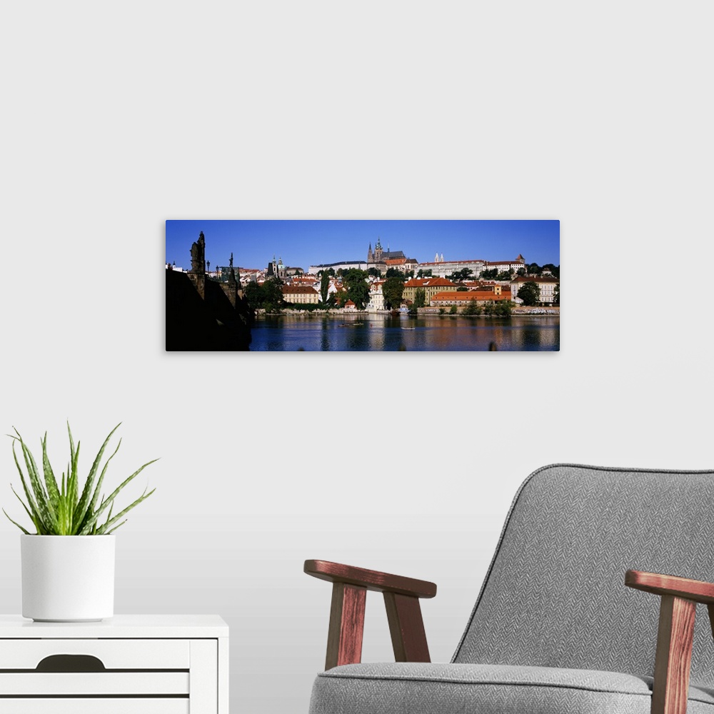 A modern room featuring Lake in front of a city, Charles Bridge, Prague, Czech Republic