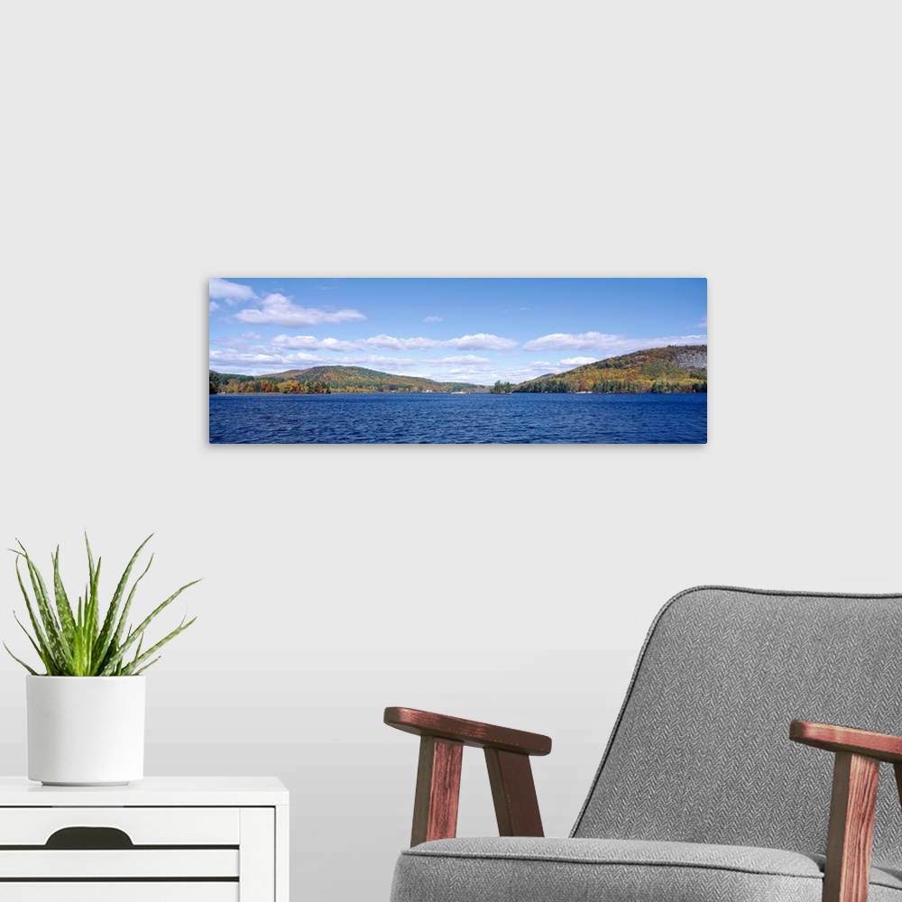 A modern room featuring Lake in front of a hill range, Bryant Pond, Maine, New England