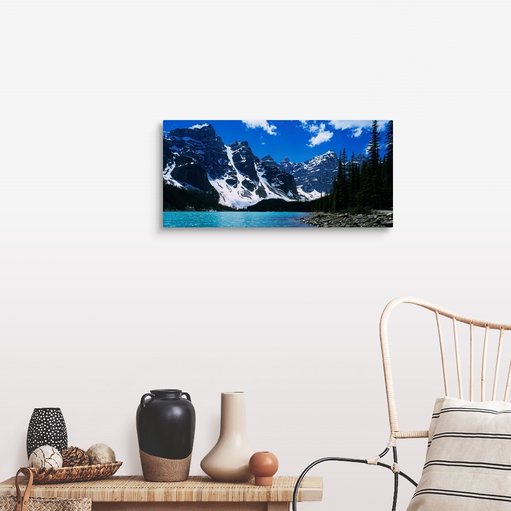 A farmhouse room featuring A landscape photograph of snow covered mountains surround a lake on this horizontal wall art.
