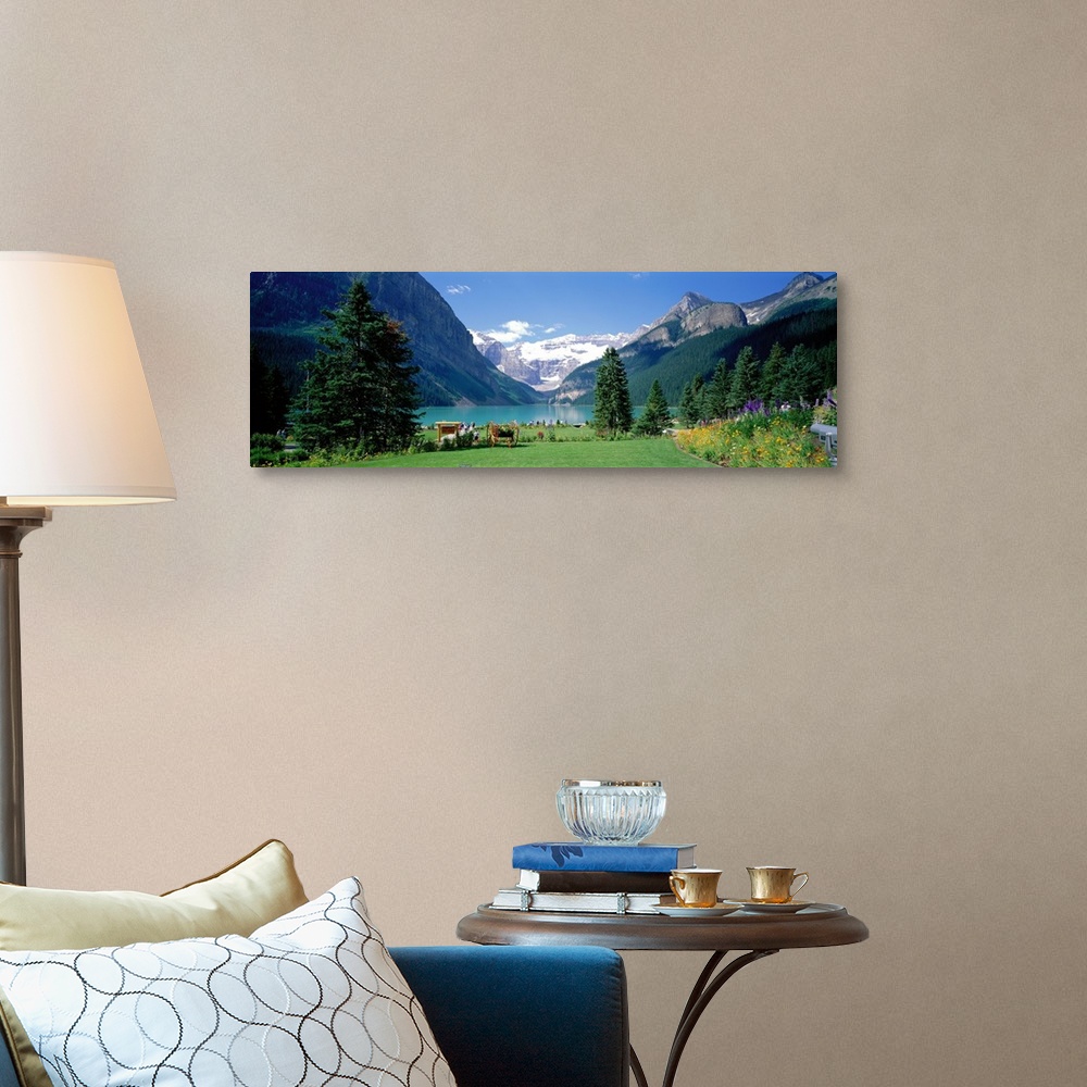 A traditional room featuring Panoramic wall docor of a smooth lakefront surrounded by rolling hills and snow capped mountains ...