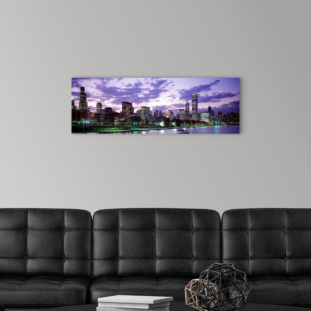 A modern room featuring A panoramic photograph taken on Lake Michigan shows the busy skyline filled with skyscrapers in C...