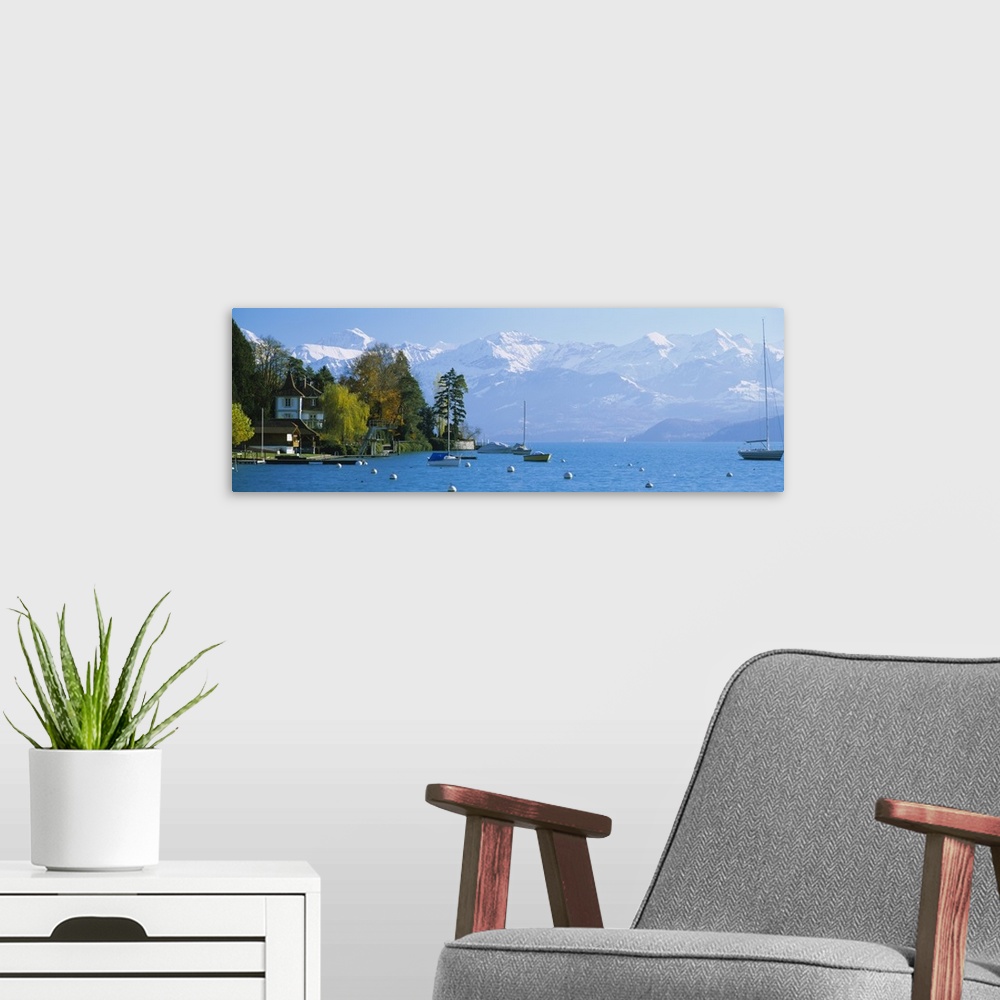 A modern room featuring Lake Thun by Hilterfingen Canton Bern Switzerland