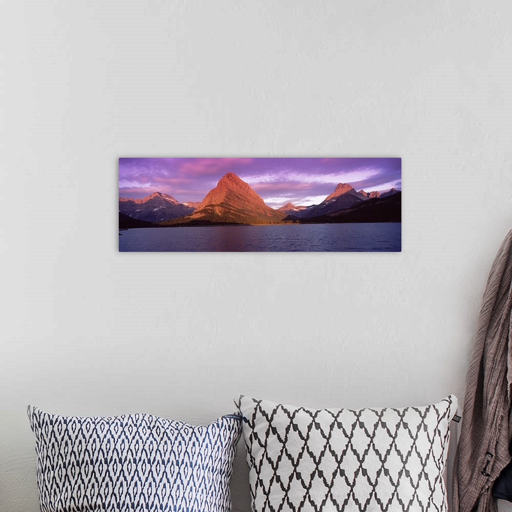 A bohemian room featuring Lake with mountains at dusk, Swiftcurrent Lake, Many Glacier, US Glacier National Park, Montana,