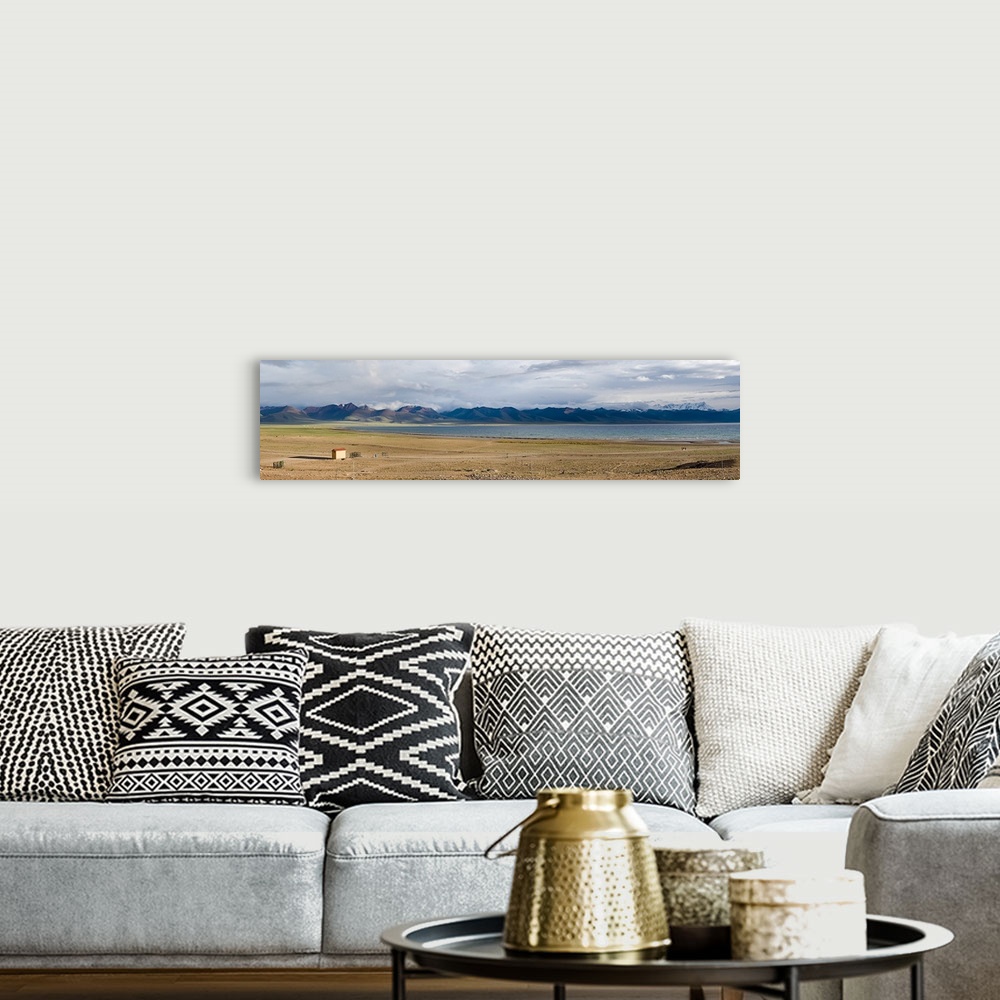 A bohemian room featuring Lake with mountains in the background, Namco Lake, Tibet, China