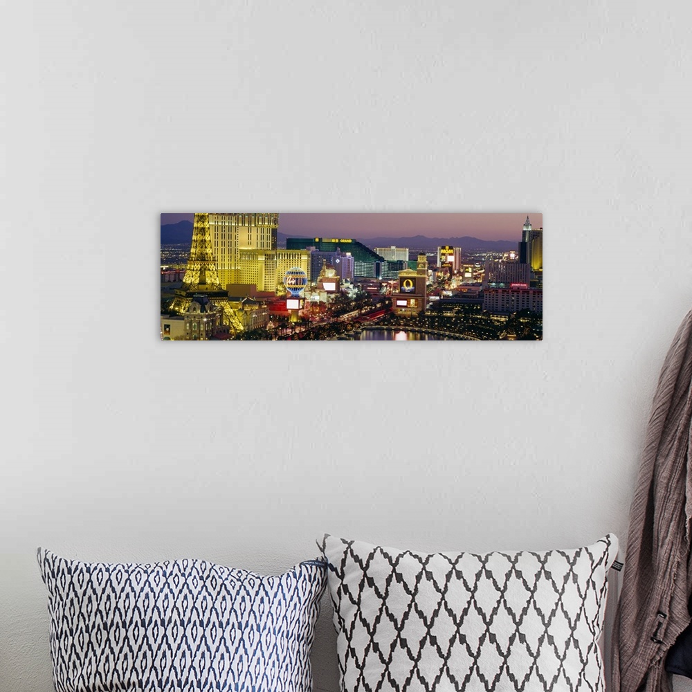 A bohemian room featuring Panoramic photograph taken of the Las Vegas skyline at night with the bright lights of the buildi...