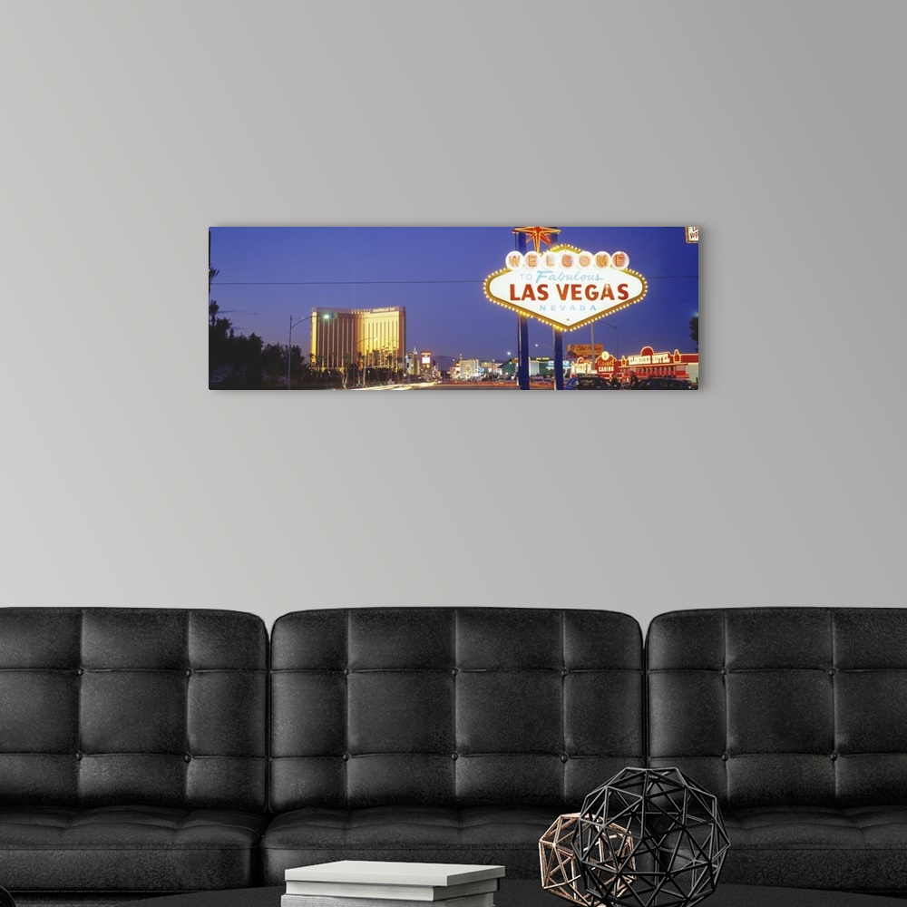 A modern room featuring Giant photograph shows the famous neon sign that welcomes people as they enter the nicknamed "Sin...