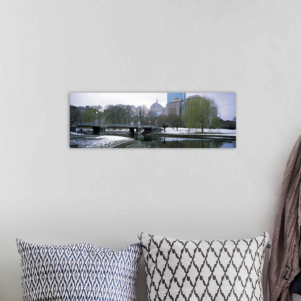 A bohemian room featuring Panoramic photo print of a snowy portion of Boston near a waterfront.