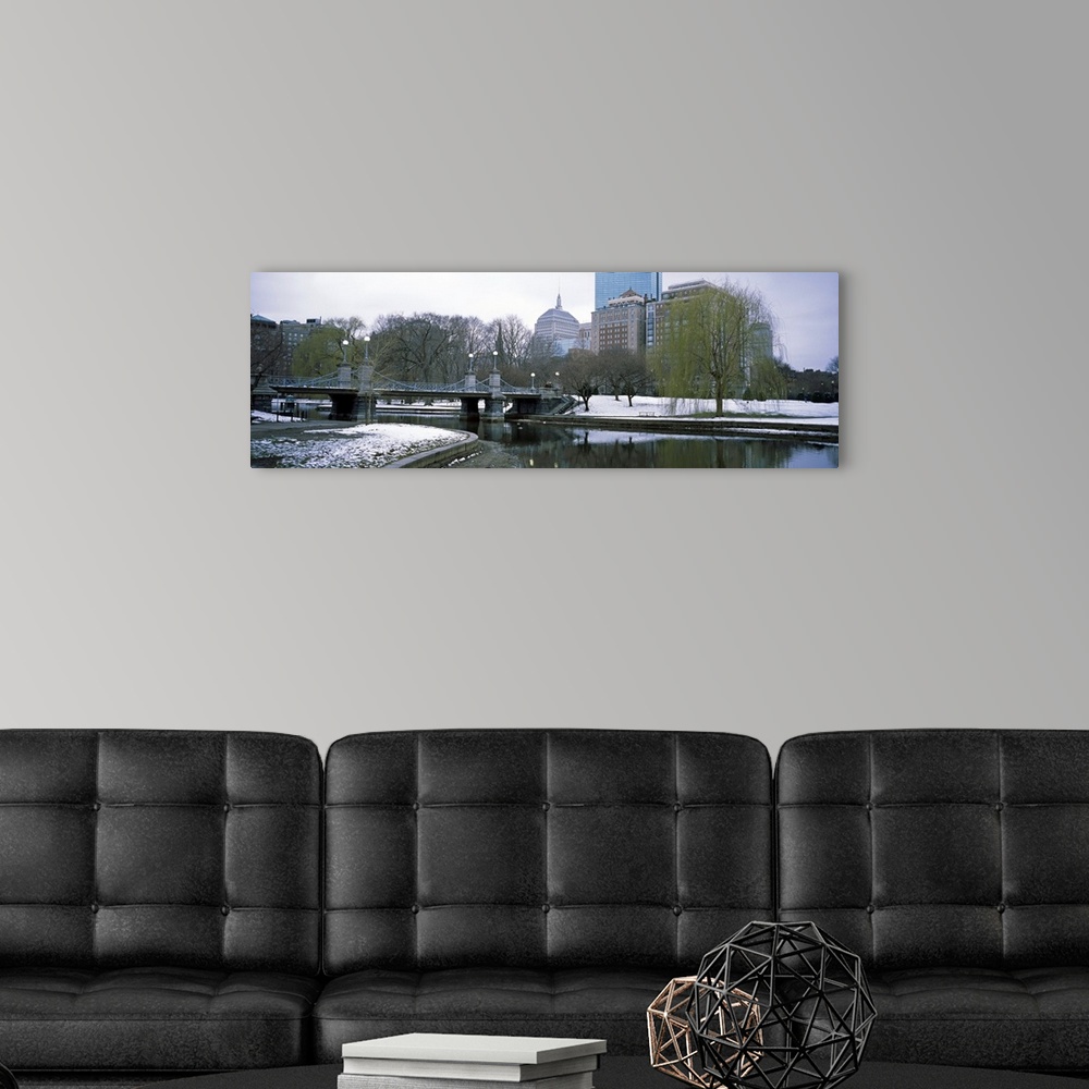 A modern room featuring Panoramic photo print of a snowy portion of Boston near a waterfront.