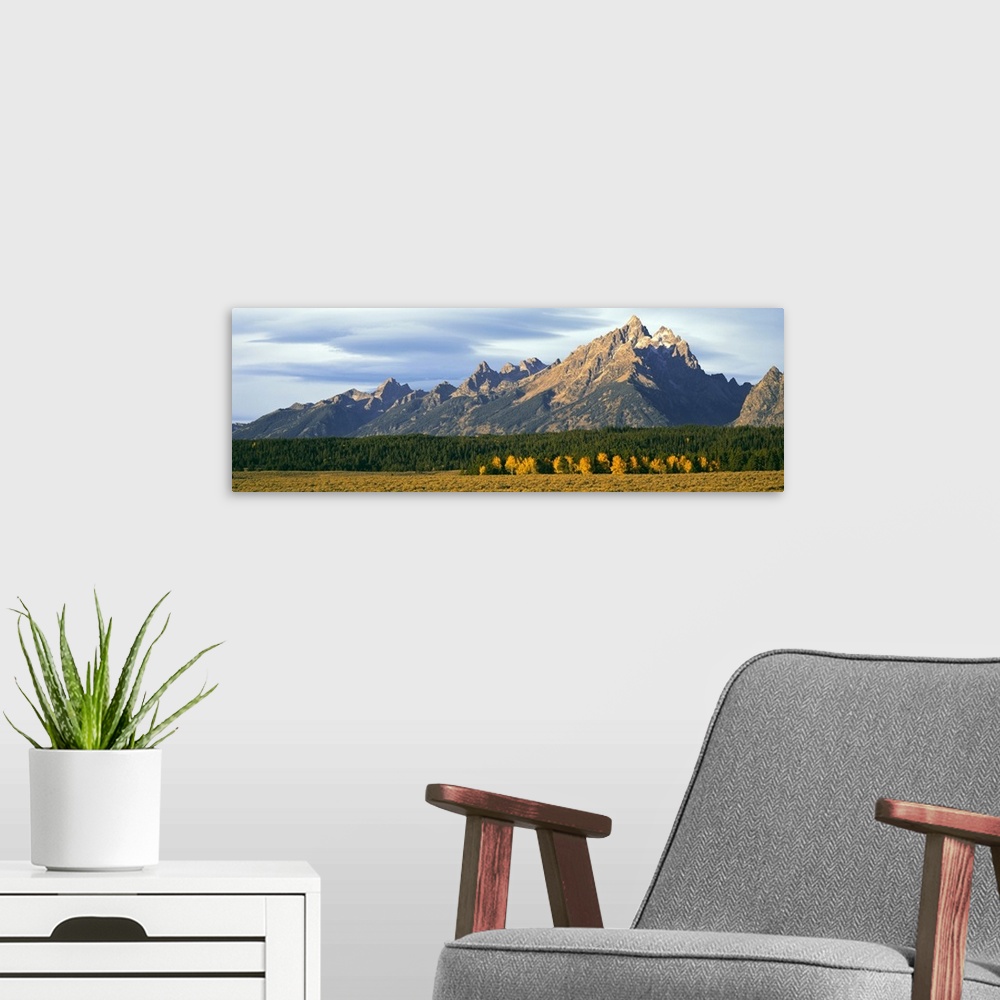 A modern room featuring Lenticular clouds over mountain range, Grand Teton National Park, Wyoming, USA.