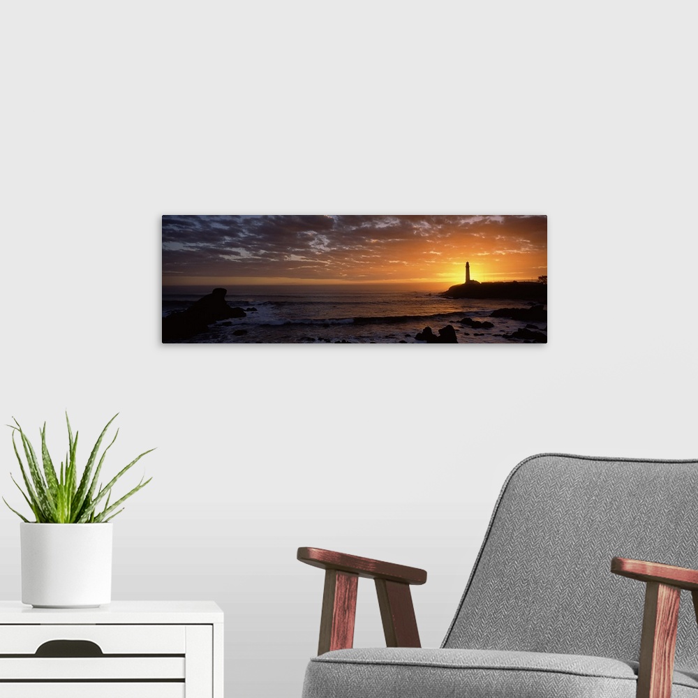 A modern room featuring Sunset behind Pigeon Point lighthouse, California