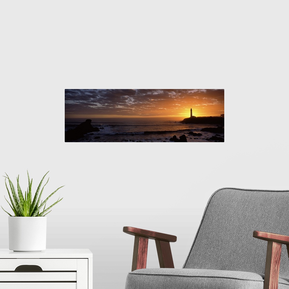 A modern room featuring Sunset behind Pigeon Point lighthouse, California