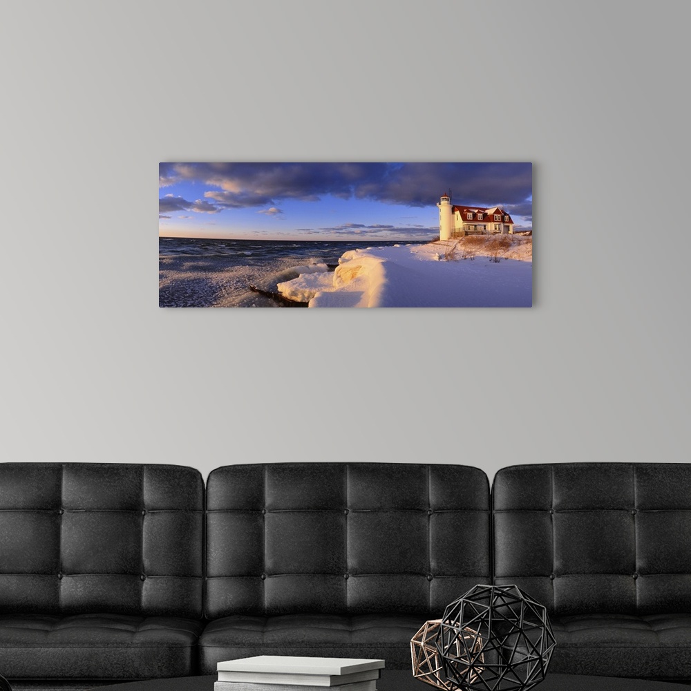 A modern room featuring Panoramic photograph taken of a snow-covered beach on the edge of a large lake within the Midwest...