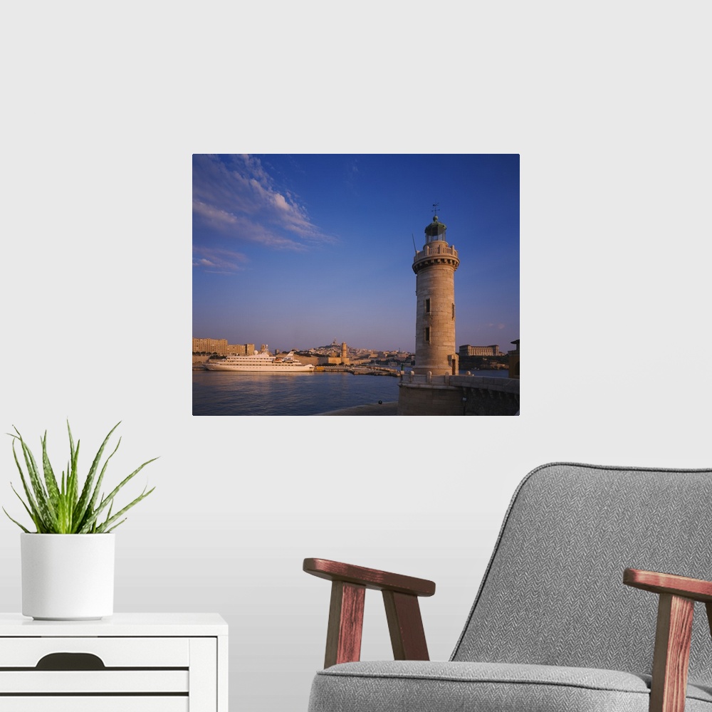 A modern room featuring Lighthouse near a port, Palais Du Pharo, Marseille, France