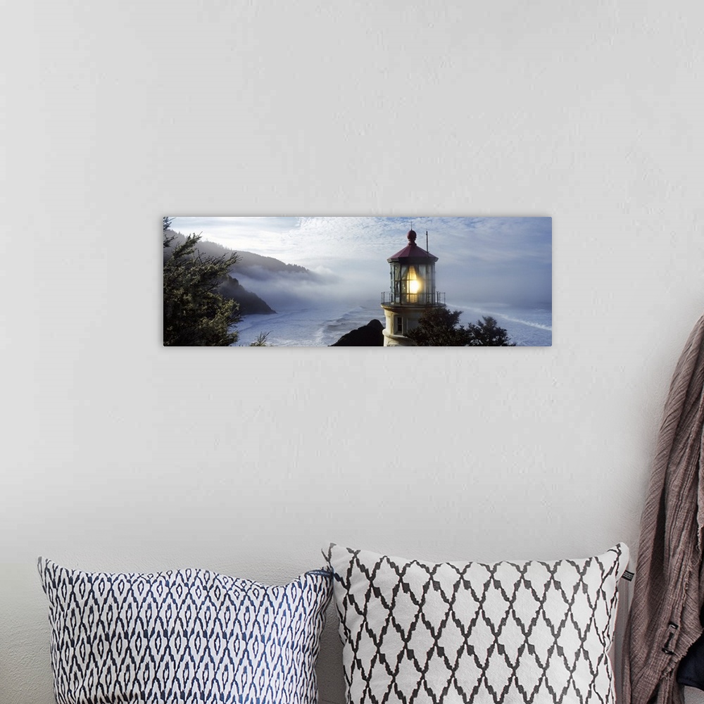 A bohemian room featuring Big panoramic photograph of the Heceta Head Lighthouse and trees on a cliff overlooking Heceta He...