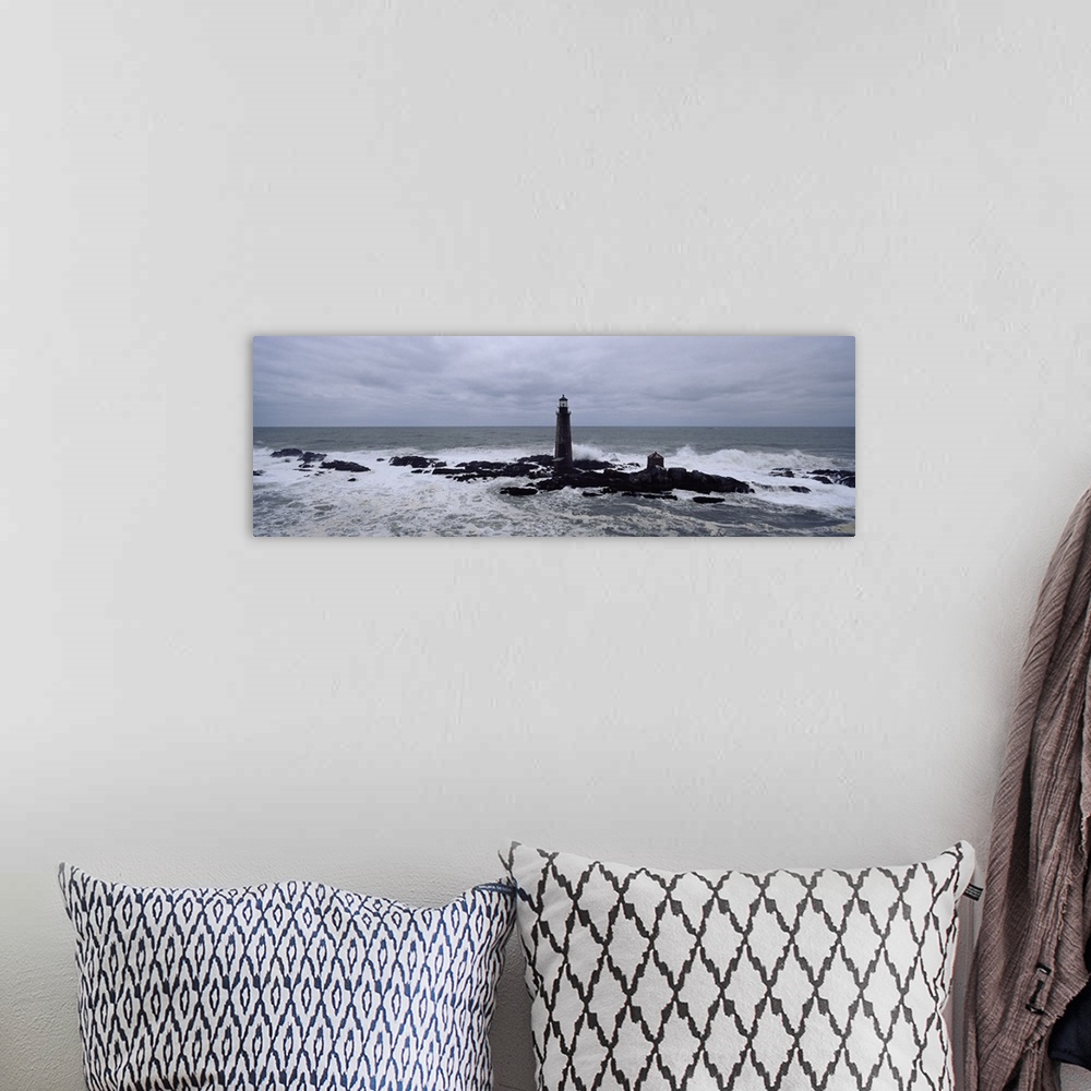 A bohemian room featuring This decorative wall art is a panoramic photograph taken on an overcast day of a lighthouse built...
