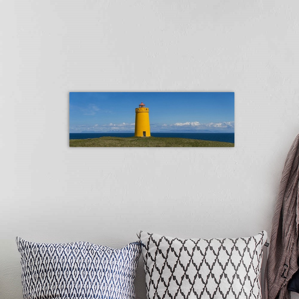 A bohemian room featuring Lighthouse on the coast, Holmbergsviti Lighthouse, Keflavik, Iceland.