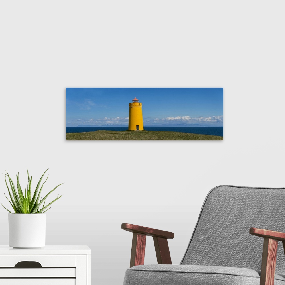 A modern room featuring Lighthouse on the coast, Holmbergsviti Lighthouse, Keflavik, Iceland.