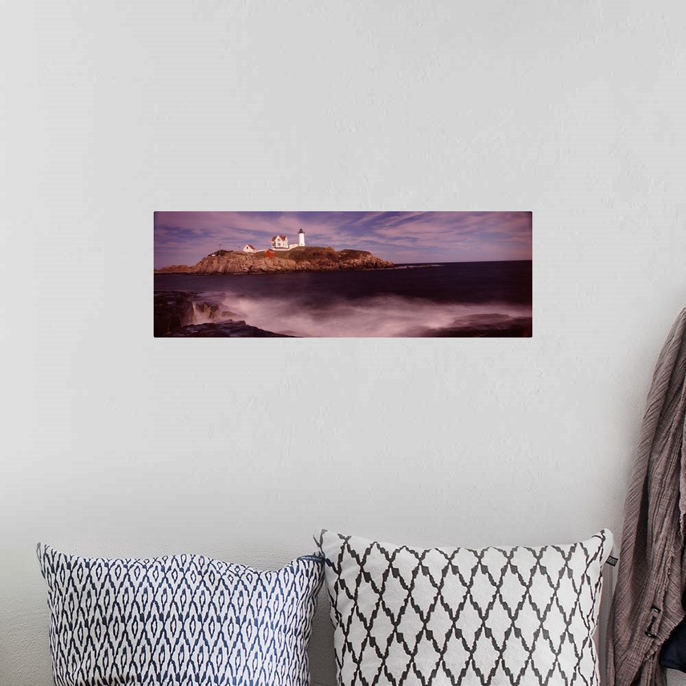 A bohemian room featuring Panoramic photograph of Nubble Lighthouse on top of a rocky hillside, along the coast of York, Ma...