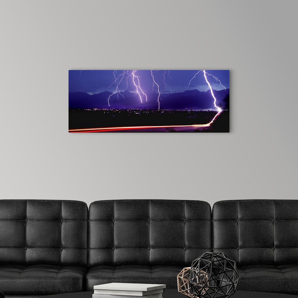 A modern room featuring Lightning over a city
