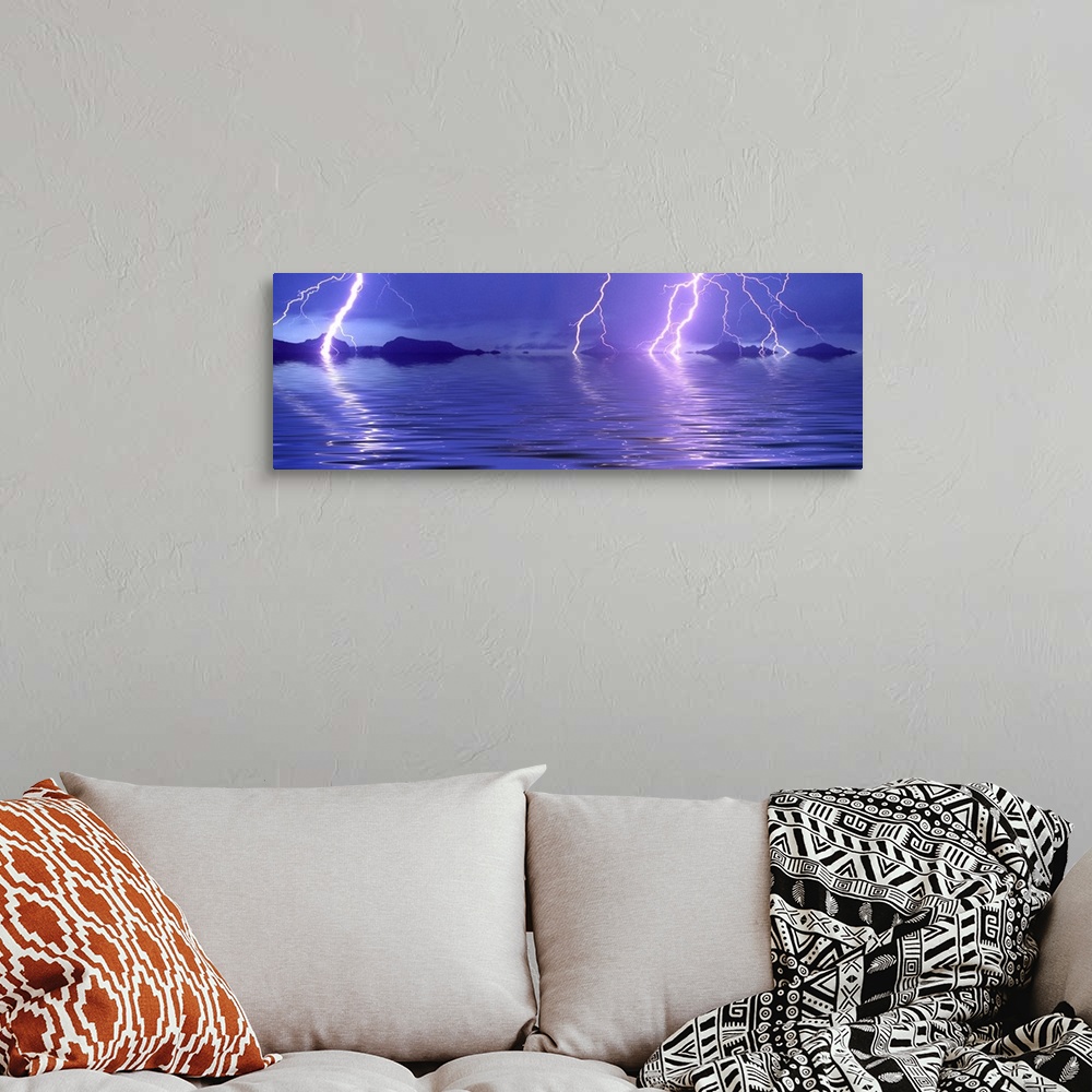 A bohemian room featuring Panoramic photograph of thunder bolts over the ocean at night.  There are mountains scattered in ...