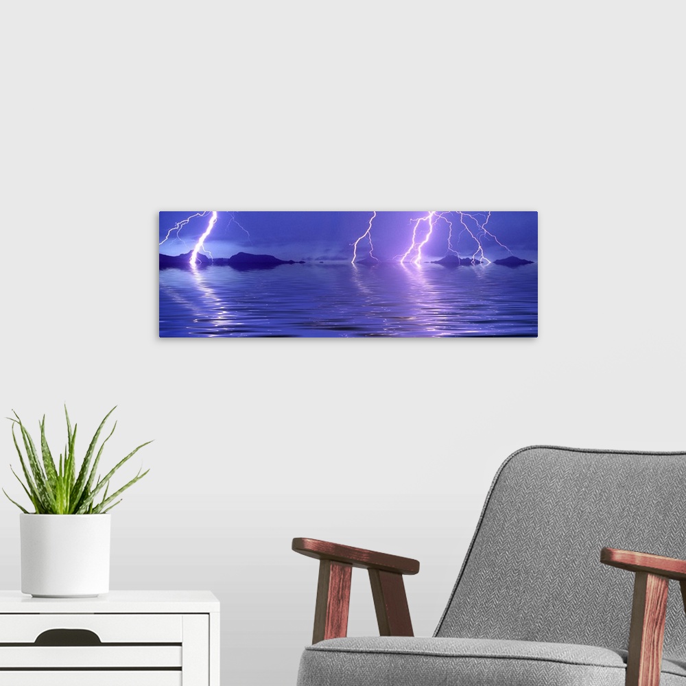 A modern room featuring Panoramic photograph of thunder bolts over the ocean at night.  There are mountains scattered in ...