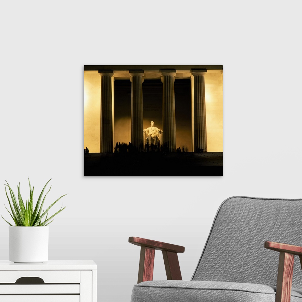 A modern room featuring Lincoln Memorial illuminated at night, Washington DC