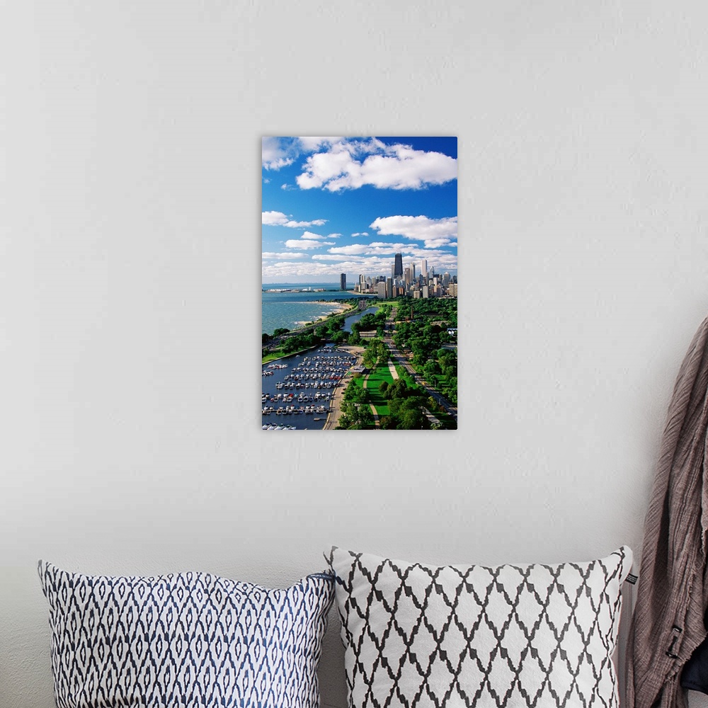 A bohemian room featuring A vertical cityscape photograph of the urban areas along Lake Michigan.