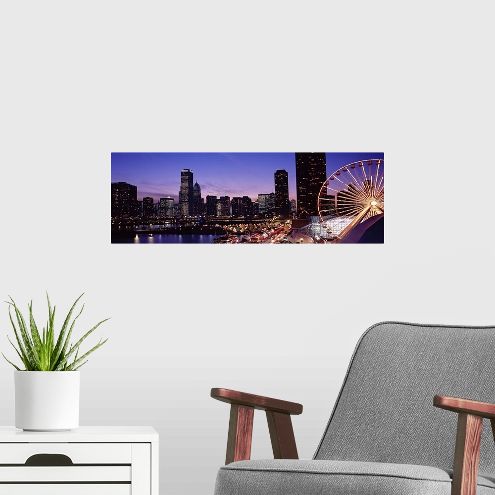 A modern room featuring Panoramic photograph taken of a brightly lit skyline within a lively city in the Midwestern Unite...