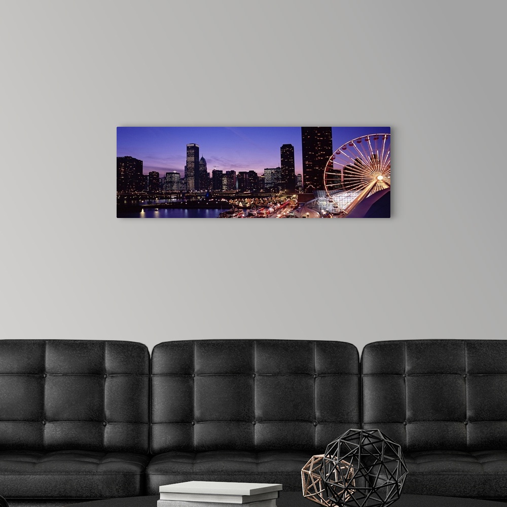 A modern room featuring Panoramic photograph taken of a brightly lit skyline within a lively city in the Midwestern Unite...