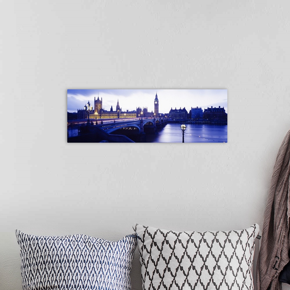 A bohemian room featuring London skyline with the Houses of Parliament and Big Ben. Panoramic image taken at dusk with ligh...