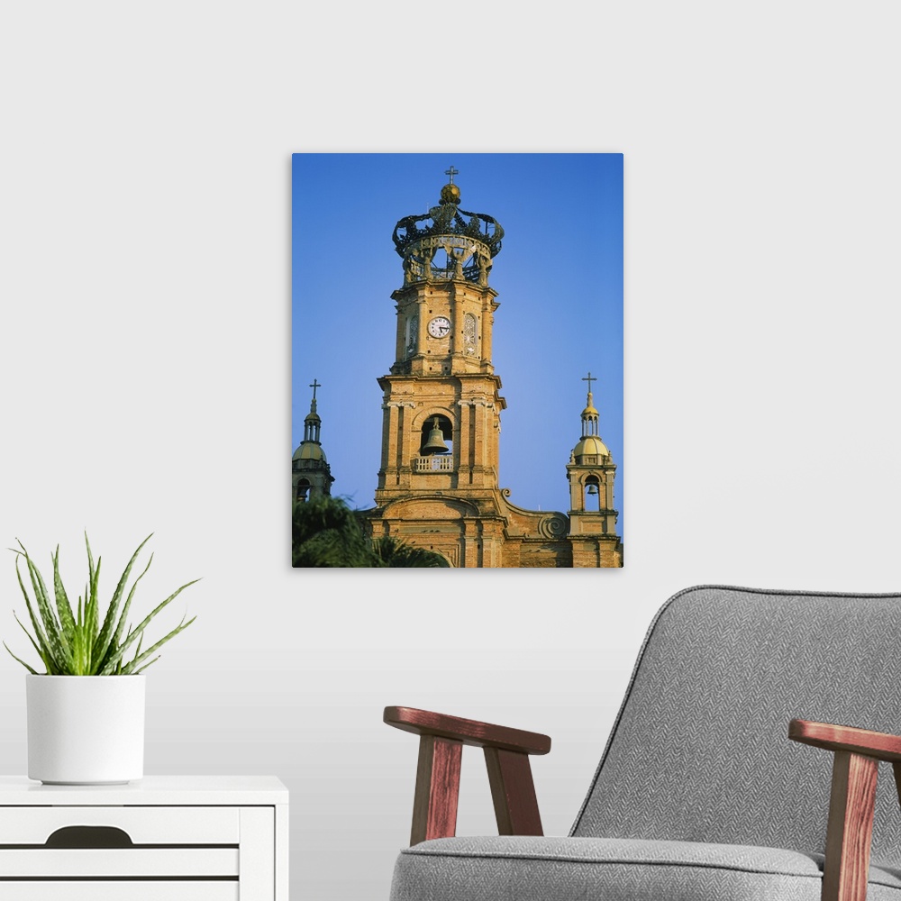 A modern room featuring Low angle view of a bell tower of a cathedral, Cathedral of Our Lady of Guadalupe, Puerto Vallart...